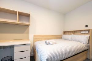 a small bedroom with a bed and a desk at Practical Room For One, Central Nottingham in Nottingham +23 photos