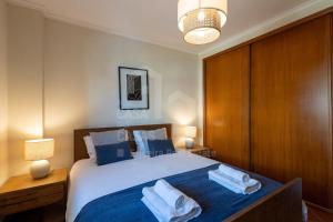 En eller flere senge i et værelse på Kiko's House by ACasaDasCasas