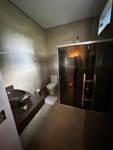 a bathroom with a sink and a toilet at Villa'S Roraima in Boa Vista +15 photos