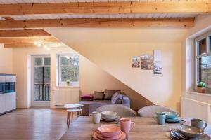 a living room with a table and a couch at Ferienwohnung 2 Hof Schäfer in Waldeck