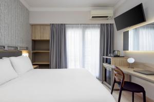 Posteľ alebo postele v izbe v ubytovaní Pan Hotel + 37 fotografií