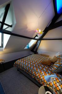 Postel nebo postele na pokoji v ubytování B&B Het Havenhuis