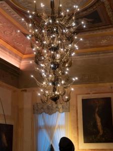 a chandelier hanging from a ceiling in a room at Hotel Aquarius Venice - Ascend Collection in Venice