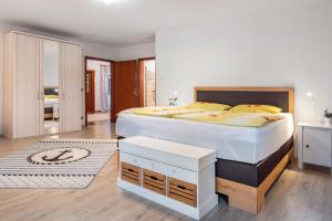 a bedroom with a large bed in a room at Ferienhaus Timm in Meldorf