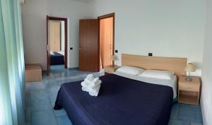 Ένα ή περισσότερα κρεβάτια σε δωμάτιο στο Residence Villaggio Alemia +34 φωτογραφίες