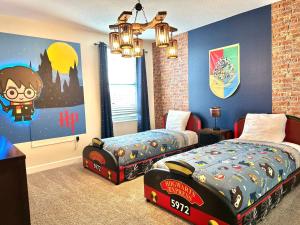 a bedroom with two beds and a large painting at Amazing 9 bd 5 bath with pool spa 287 in Davenport