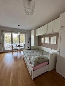 a bedroom with a bed and a desk in it at Hygge Studio in Rome