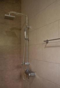 a shower with a shower head in a bathroom at Family Home in Homagama