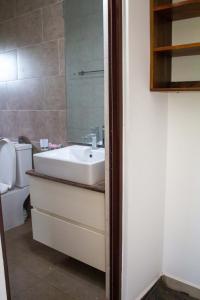 a bathroom with a sink and a toilet at Family Home in Homagama +10 photos