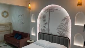 a bedroom with a bed and a couch in a room at Kastoria NYC in Kastoria