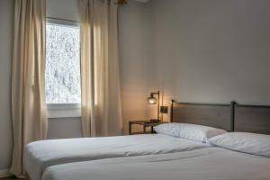 Postel nebo postele na pokoji v ubytování Teso dera Mina by Totiaran
