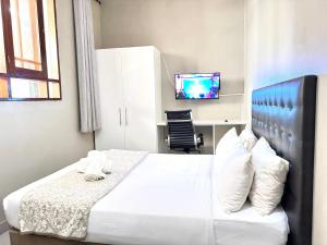 Postel nebo postele na pokoji v ubytování Angel Boutique Hotel