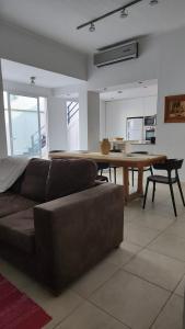 a living room with a couch and a wooden table at Chacabuco 386 in Santiago del Estero