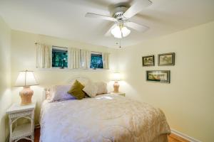 a bedroom with a bed with a ceiling fan at Cherry Cottage - Walk to Peninsula State Park! in Ephraim