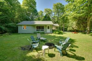 a group of chairs sitting around a fire in a yard at Cherry Cottage - Walk to Peninsula State Park! in Ephraim