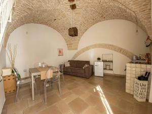 a living room with a couch and a table at Martine Dimore Storiche di Puglia in Martina Franca
