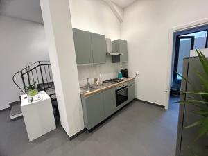 Kuchyň nebo kuchyňský kout v ubytování Arkè Rooms