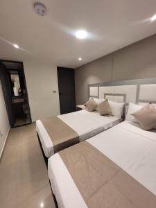 Postel nebo postele na pokoji v ubytování Hotel Med 33 + 10 fotografií