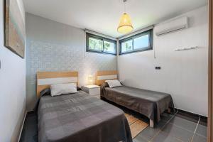 A bed or beds in a room at Villa Holivista