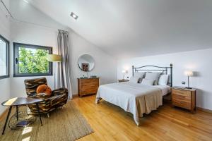 A bed or beds in a room at Villa Holivista