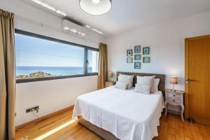 A bed or beds in a room at Villa Holivista