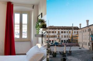 una camera con letto e vista sulla città di Erikasa - soggiorna in centro a Cormons a Cormòns