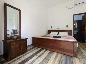 Postel nebo postele na pokoji v ubytování Caspian Mirissa