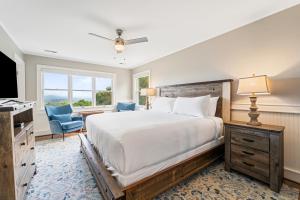 a bedroom with a large bed and a television at Inn at Brierley Hill in Lexington