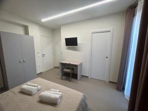 TV a/nebo společenská místnost v ubytování Arkè Rooms