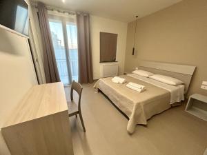 TV a/nebo společenská místnost v ubytování Arkè Rooms