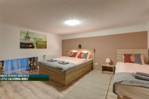 a bedroom with two beds in a room at Little Americas Museum Apartments in Budapest +37 photos