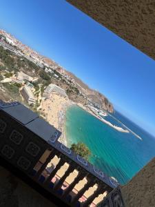 a view of a beach from a balcony at Elhociema Qeumado in Al Hoceïma