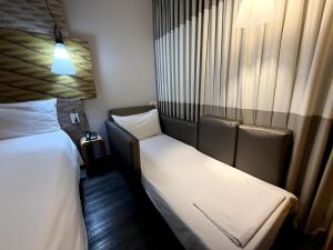 Postel nebo postele na pokoji v ubytování ibis Sao Paulo Ibirapuera