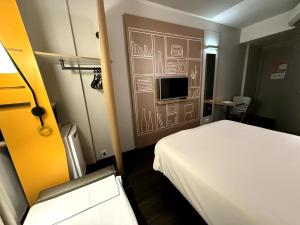 Postel nebo postele na pokoji v ubytování ibis Sao Paulo Ibirapuera