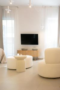 TV a/nebo společenská místnost v ubytování Urban mirage + 10 fotografií