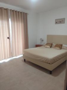 Postel nebo postele na pokoji v ubytování Vinci Residence - VR + 5 fotografií