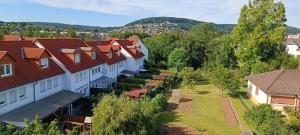 an overhead view of a row of houses with red roofs at House Bahamas in Büdingen