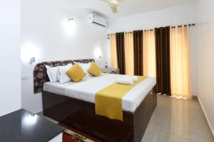Hotel Samudra Tara客房内的一张或多张床位