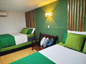 Postel nebo postele na pokoji v ubytování HOSTAL LA BOQUILLA + 37 fotografií