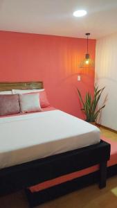 Postel nebo postele na pokoji v ubytování HOSTAL LA BOQUILLA
