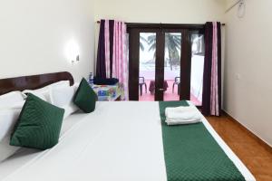 Hotel Samudra Tara客房内的一张或多张床位