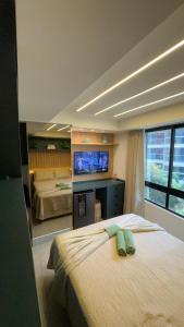 TV a/nebo společenská místnost v ubytování 403 belíssimo Studio no cabo branco