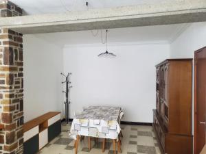 a bedroom with a bed and a table in a room at Maison Cosy à Rieux-Minervois in Rieux-Minervois