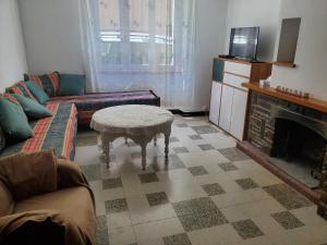 a living room with a couch and a coffee table at Maison Cosy à Rieux-Minervois in Rieux-Minervois