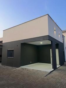 a large building with a large garage at Casa 100% mobiliada no Caçari in Boa Vista