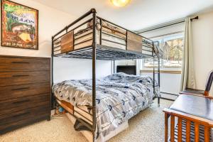 a bedroom with a bunk bed and a dresser at Dillon Reservoir On-Site Central and Scenic Condo! in Dillon