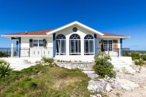 a house on the beach at Waterside Home, Shaded Whirlpool Spa, Outdoor Dining, Smart TV, Amazon Prime in Providenciales +20 photos