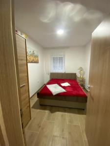 Posteľ alebo postele v izbe v ubytovaní Apartman Emilija