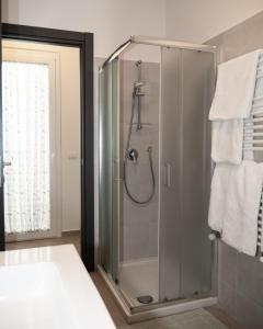 a shower with a glass door in a bathroom at Vista Capo d'Orlando in Capo dʼOrlando +28 photos