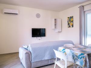 a living room with a couch and a table at Vista Capo d'Orlando in Capo dʼOrlando